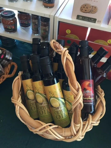 Olive oils in a basket on display.